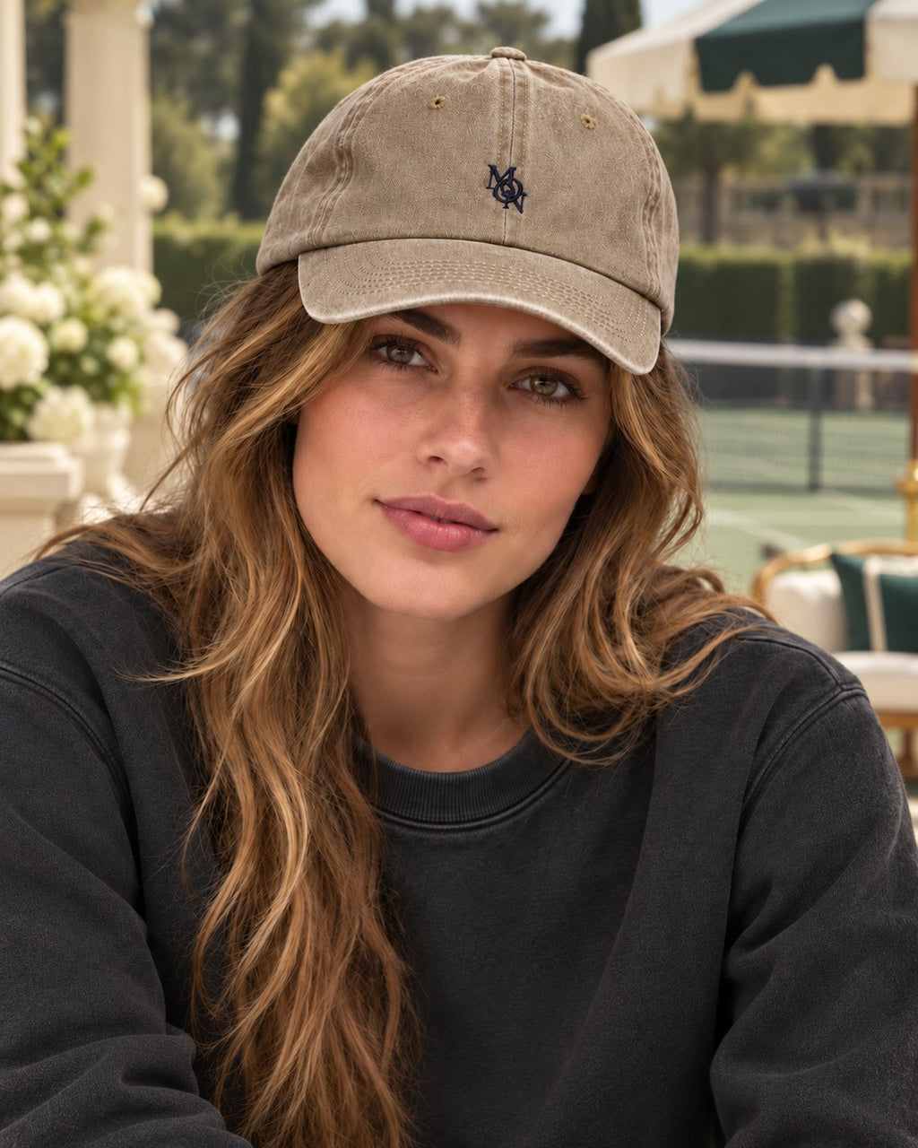 Hamptons Sand Cap — model from the front at the tennis club