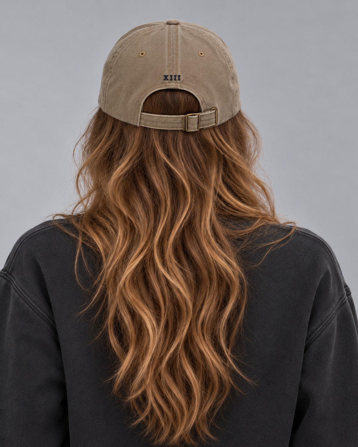 Hamptons Sand Cap — model from behind, embroidered XIII numeral and buckle