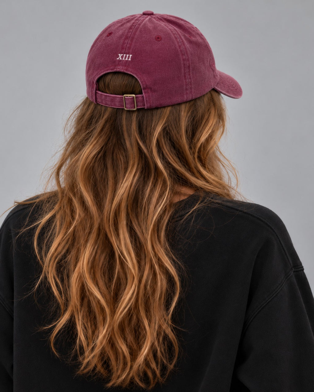 Hamptons Wine Cap — model from behind, embroidered XIII numeral and buckle