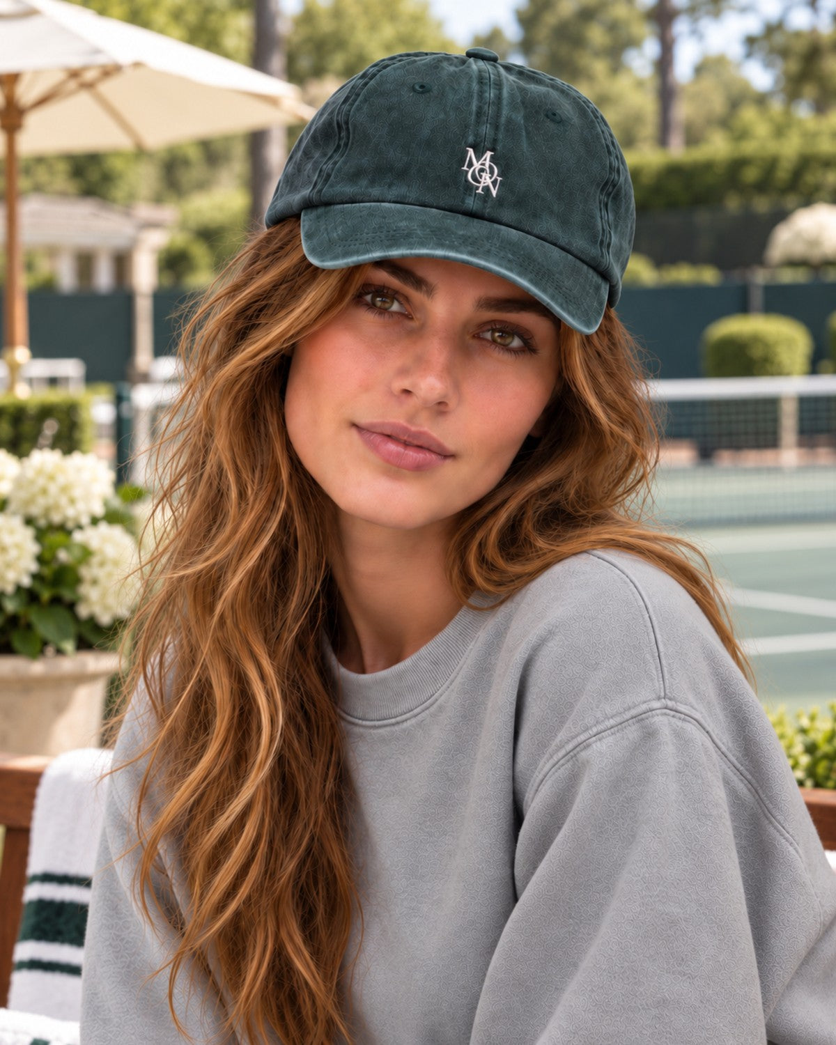 Hamptons Forest Cap — model from the front at the tennis club