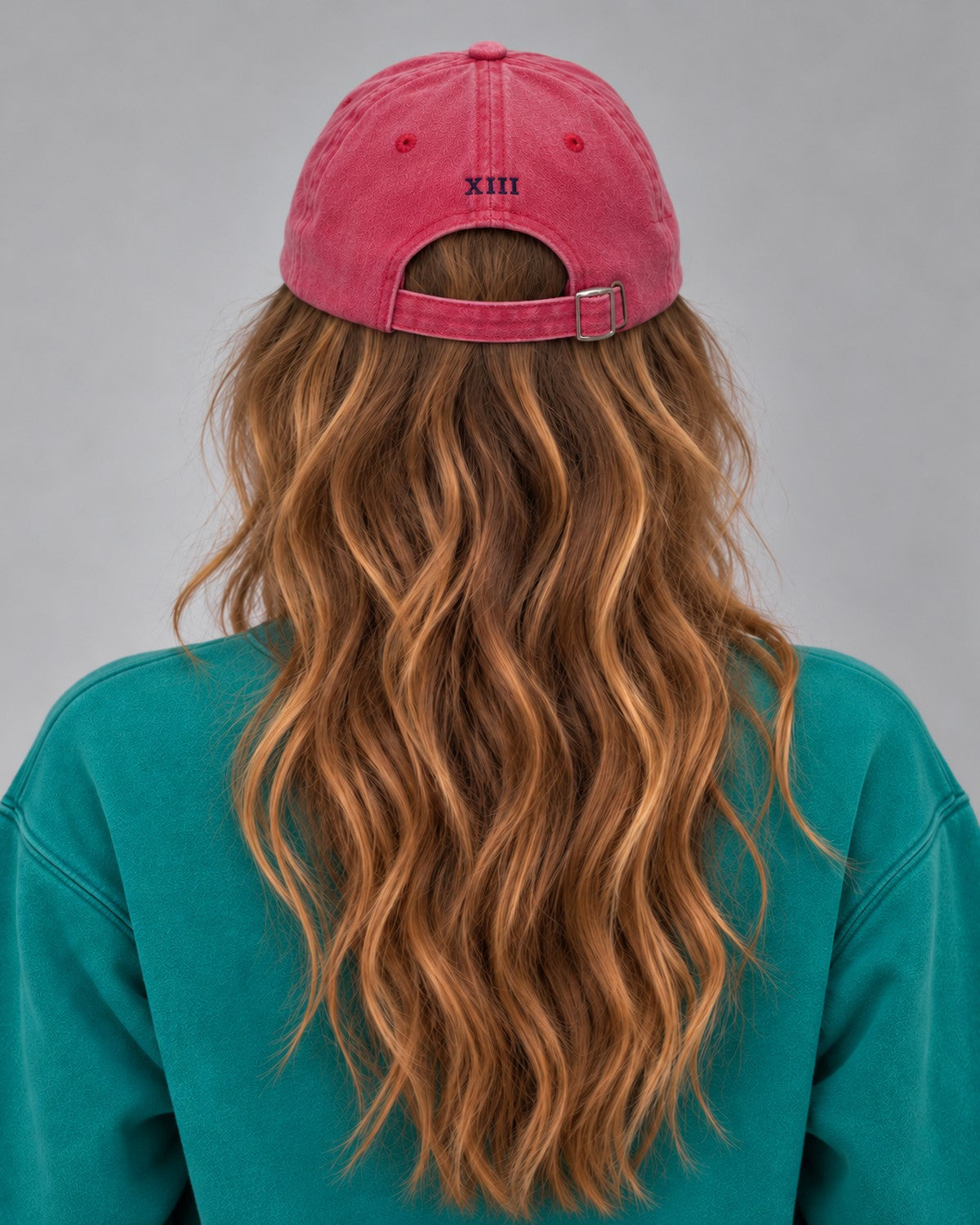 Hamptons Raspberry Cap — model from behind, embroidered XIII numeral and buckle