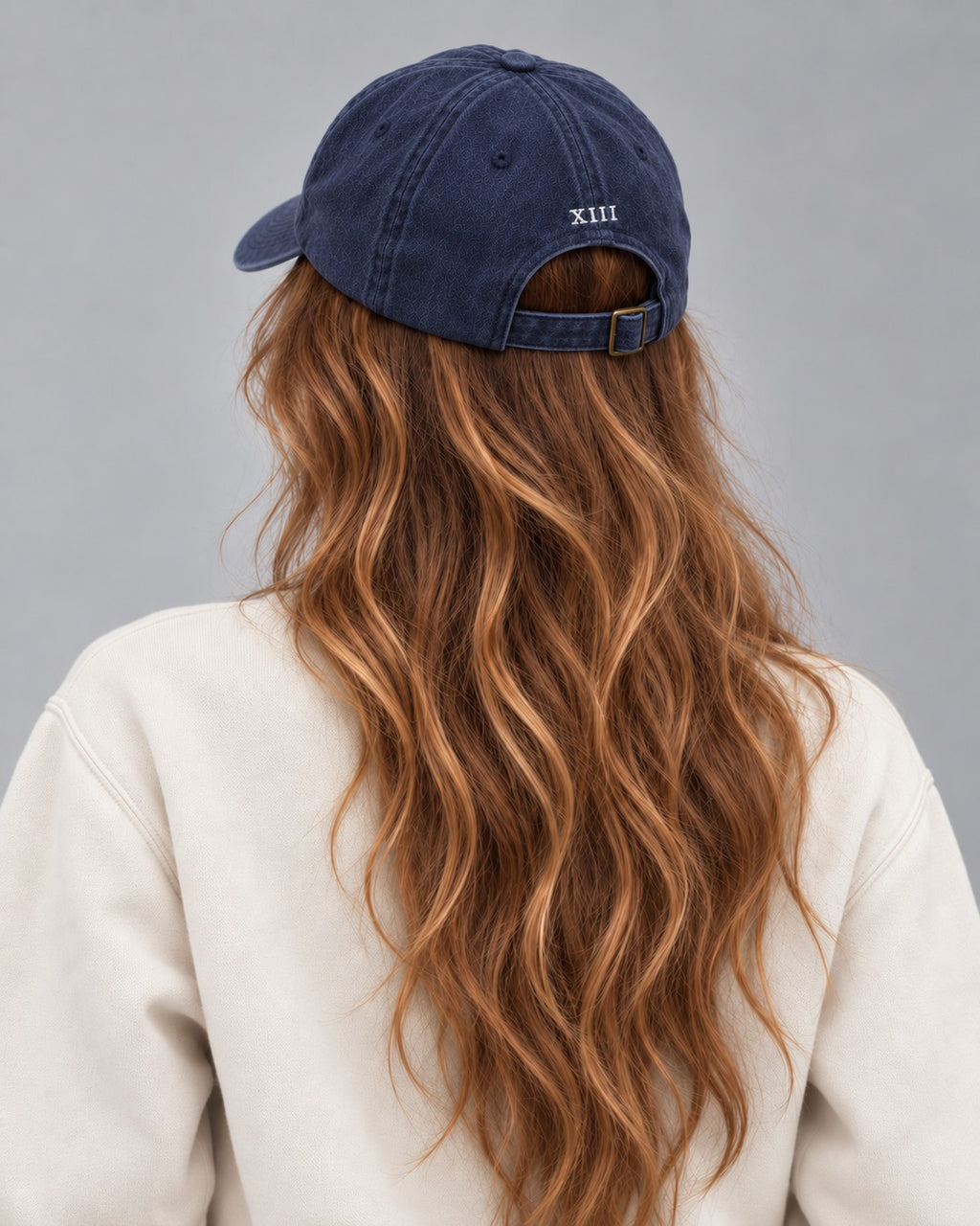 Hamptons Navy Cap — model from behind, embroidered XIII numeral and buckle