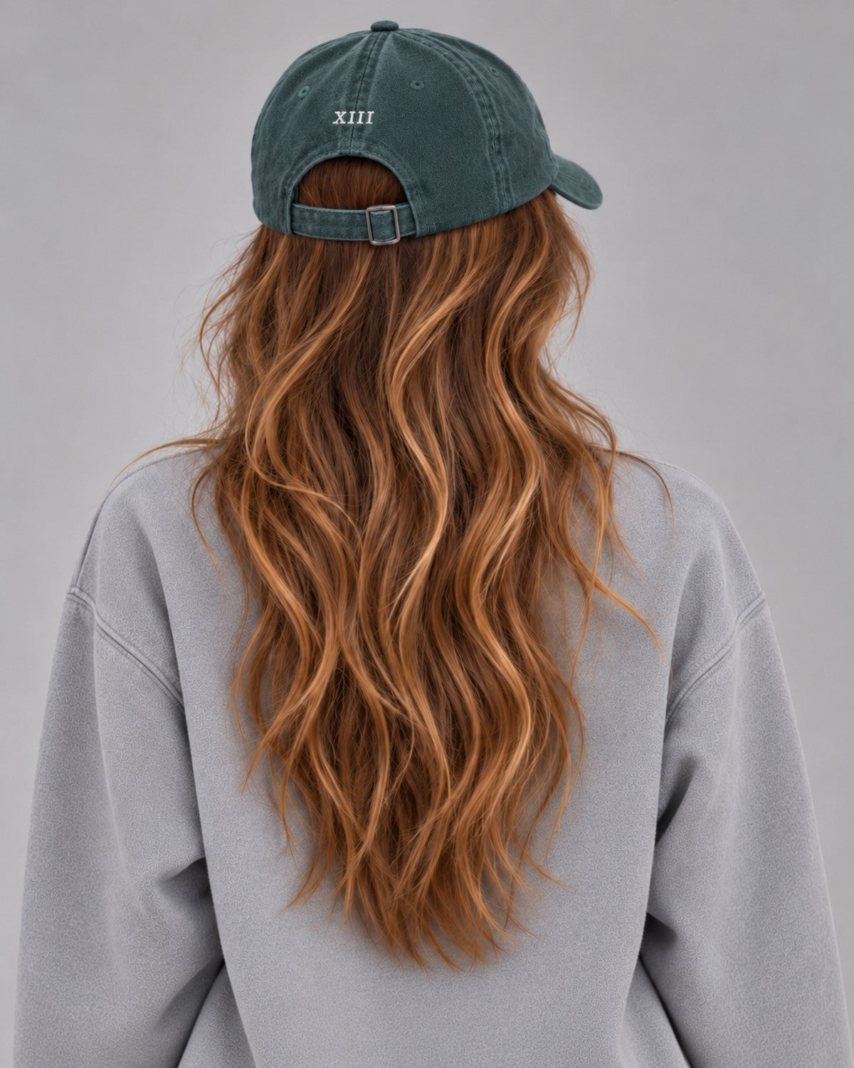 Hamptons Forest Cap — model from behind, embroidered XIII numeral and buckle